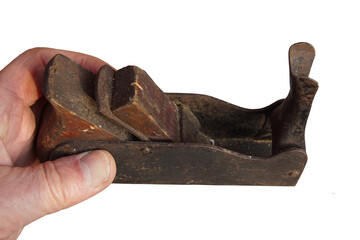 Vintage. Old rusty metal bodied small hand plane in de hand. Isolated against a white background. Netherlands. 