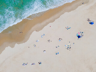 High angle view of people sunbathing on beach