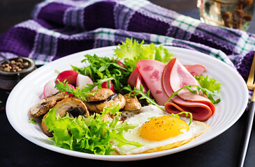 English  breakfast - fried eggs, ham, fried mushrooms, radish and arugula. ketogenic, keto  food.