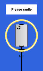 Rückansicht eines Smartphones in Silber in einer leuchtenden Ringleuchte vor blauem Hintergrund