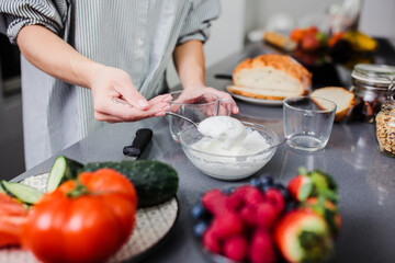Women preparing healthy food playing with vegetables in kitchen having fun concept dieting nutrition.