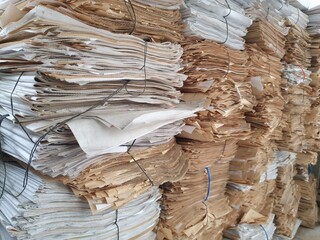 Stacks of tied waste paper for disposal.