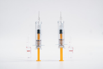 Two syringes and vial on white background for injection. Healthcare and Medical concept for covid-19. A covid-19 coronavirus vaccination concept. It use for prevention, immunization and treatment.