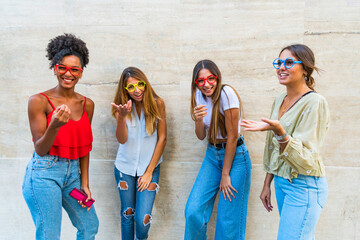 Fototapeta premium Happy young people holding fake eyeglasses