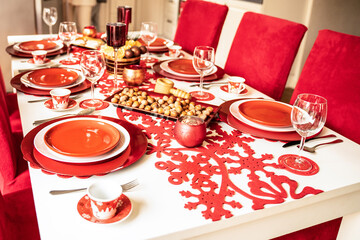 Photo of Christmas holidays red table setting concept.