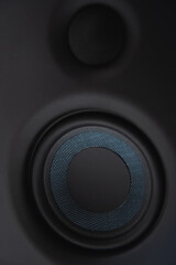 speakers blue and black on desk closeup for audio services 