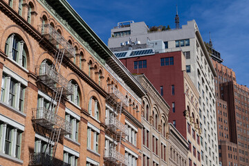 Fototapeta na wymiar Row of Colorful Brick Buildings along a Street in Tribeca of New York City