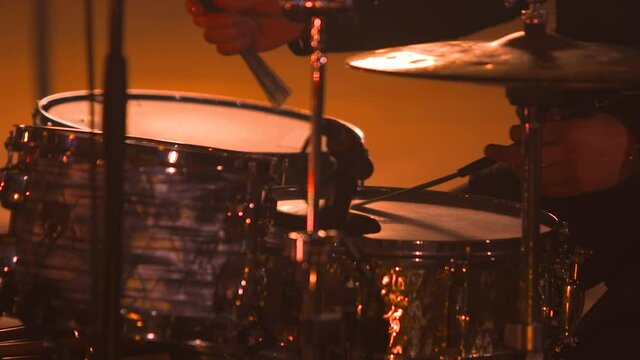 Jazz drummer musician hands close up drum brushes slow circles rhythm