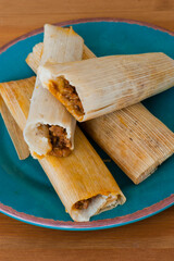 Tamales. Classic méso-américain or Mexican cuisine. Seasoned Meats wrapped in masa dough and steamed in corn husks or banana leaves. Traditional regional cuisine.