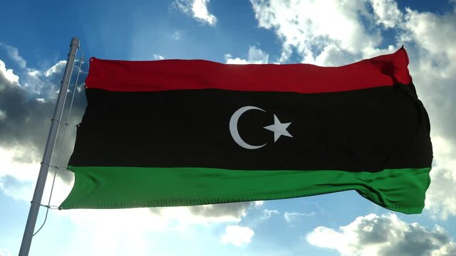 Libya National flag waving in the wind, blue sky background