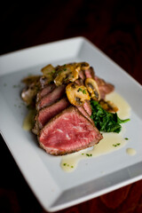 Steak and potatoes. Grade A grass fed angus beef steaks. Tenderloin, filet mignon, New York strip, bone in rib-eye grilled medium rare on outdoor wood-fired grill. Classic American steakhouse entree.