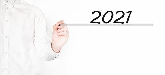 Businessman writing 2021 with black marker on transparent wipe board