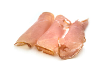 Closeup of slices of smoked ham on white background