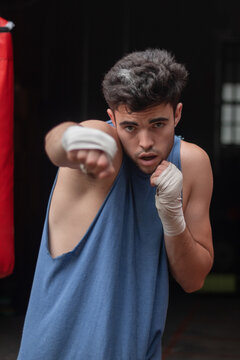 young model throwing punches boxing