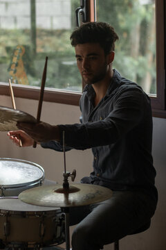 Male drummer playing in studio