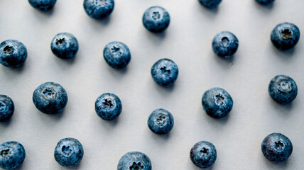  blueberries are placed on a dark gray background