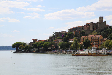 Fototapeta na wymiar View of the village of Passignano on Lake Trasimeno, Italy