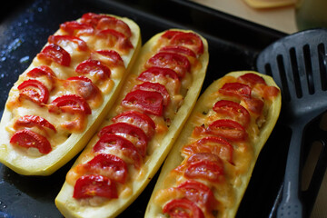 Vegetable snack. Zucchini sandwich with tomatoes. Vegetarian food from the oven. Top view