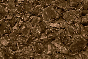 Abstract background of many large stones. Empty stone surface of dark color. Blank for design.