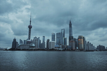 Naklejka premium View from the embankment of Shanghai to the other side. Orient Pearl Tower Business Center and Observation Deck