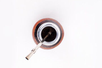 Traditional yerba mate tea in the calabash circle and Bombilla. White background.