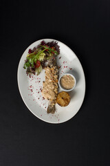 Stuffed trout with mushrooms sauce and salad