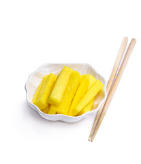 Marinated daikon slice with chopsticks isolated on white