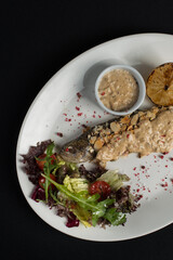 Stuffed trout with mushrooms sauce and salad