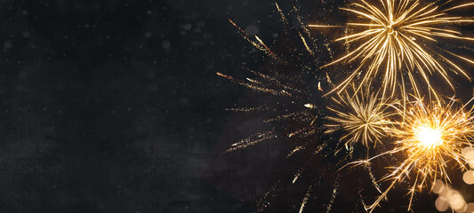 Silvester New Year 2024, New Year's Eve background banner panorama long- firework and sparklers on...