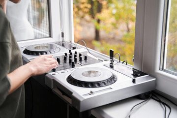 Woman working at the dj set