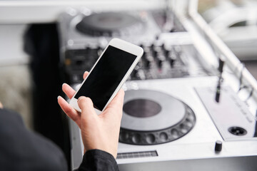 Woman holding modern smartphone