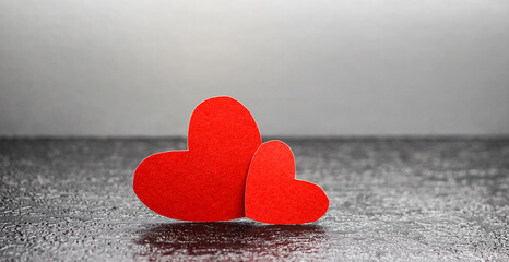 Fototapeta premium Red hearts on a black background. Valentine.