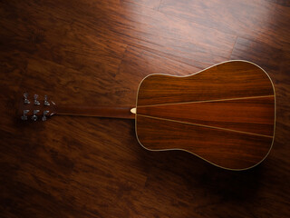 Obraz premium Guitar on wooden background