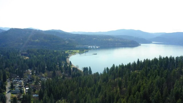 Aerial drone behind Tubbs Hill overlooking Coeur d'Alene Lake and Golf