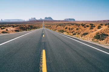 Empty asphalt road in picturesque desert