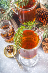 Pine Cone tea, aromatic organic winter hot tea drink with pine branch and pine cone jam, sweet and healthy winter drink concept