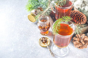 Pine Cone tea, aromatic organic winter hot tea drink with pine branch and pine cone jam, sweet and healthy winter drink concept