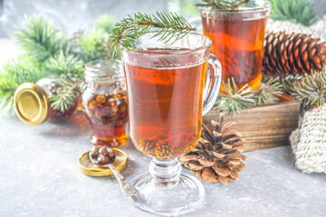 Pine Cone tea, aromatic organic winter hot tea drink with pine branch and pine cone jam, sweet and healthy winter drink concept
