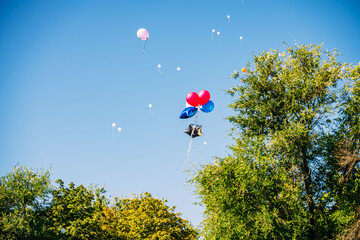 colorful balloons flying in the blue sky,
