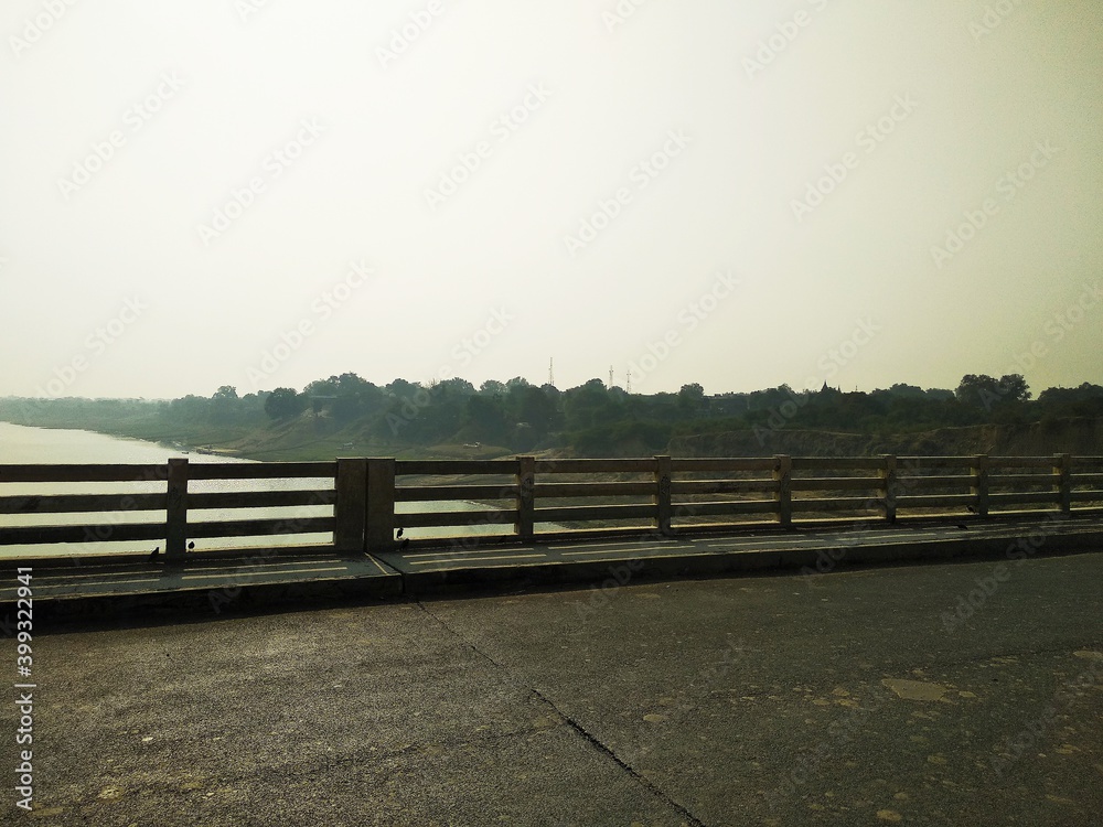 Wall mural bridge fence of a river in india