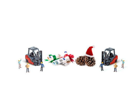 miniature worker and Christmas pine cone by forklift with euro banknote isolated on white background,  image for Christmas holiday and happy new year gift celebration concept.