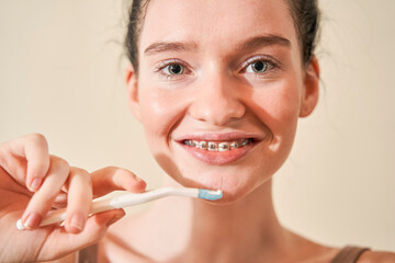 Women brushing her teeth