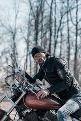 Biker portrait. Photo with a motorcycle