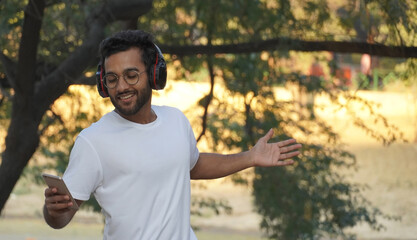 man listening to music and dancing alone