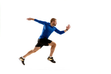 Fototapeta na wymiar High. Caucasian professional jogger, runner training isolated on white studio background. Muscular, sportive man, emotional. Concept of action, motion, youth, healthy lifestyle. Copyspace for ad.
