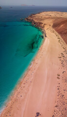 Aerial view of the beach Playa de Las Conchas in the north of La Graciosa, the main archipelago island Chinijo, a mile northwest of Lanzarote. Canary island. Spain. Ocean view and sand beach 