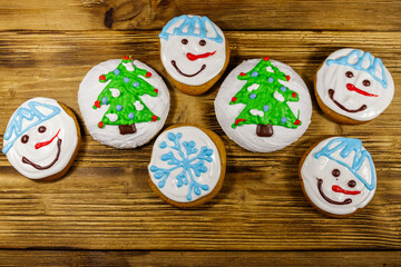 Christmas gingerbread cookies on a wooden background. Top view