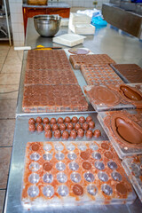 Chocolate production in molds at a local chocolate factory in Guaranda, Ecuador.
