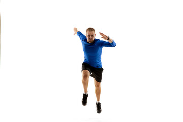 Achievement. Caucasian professional jogger, runner training isolated on white studio background. Muscular, sportive man, emotional. Concept of action, motion, youth, healthy lifestyle. Copyspace for