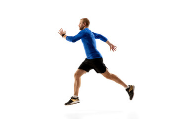 Fototapeta na wymiar Target. Caucasian professional jogger, runner training isolated on white studio background. Muscular, sportive man, emotional. Concept of action, motion, youth, healthy lifestyle. Copyspace for ad.
